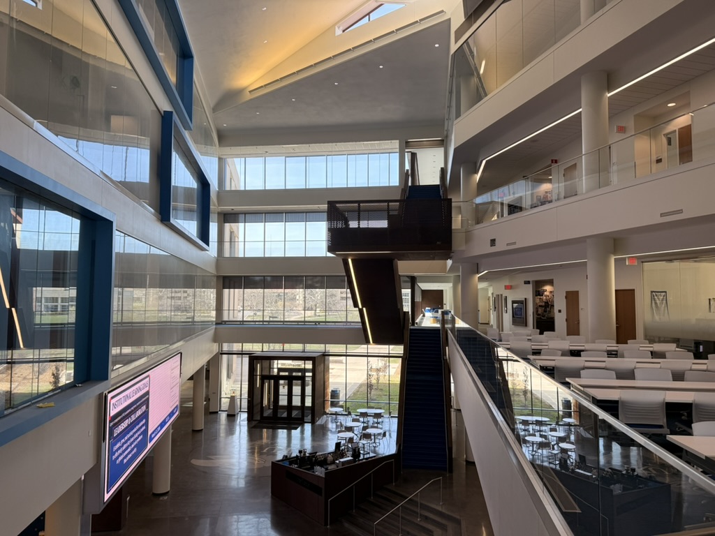 Sunlit study areas and open staircases inside Capitol Federal Hall